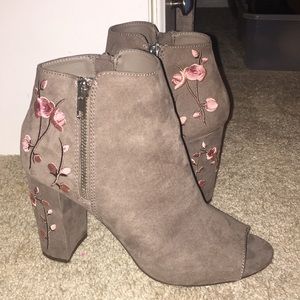 Brown open toe booties with pink floral embroidery